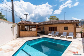 Casa na Praia Grande com piscina, churrasqueira e ar condicionado - 04 dormitórios